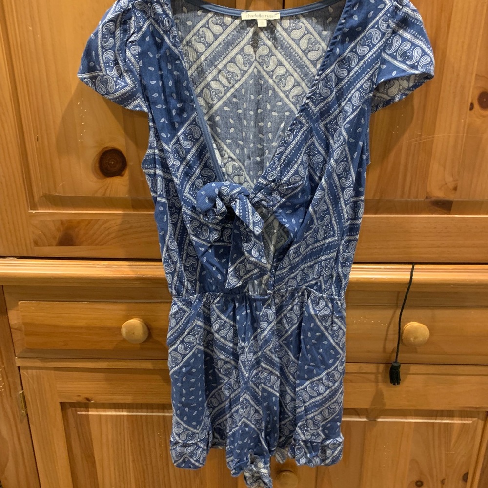 Blue romper with open hole in middle